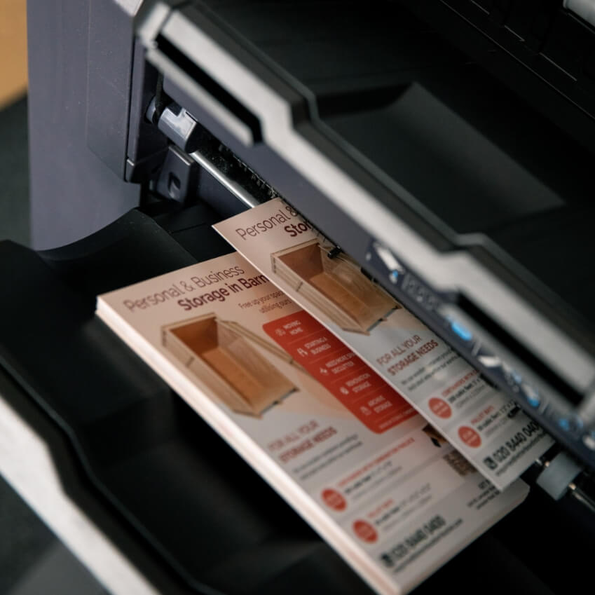 a printer is printing out some leaflets